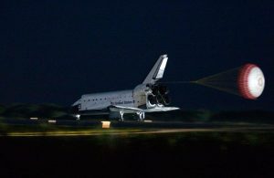 Atlantis lands at the Kennedy Space Center, bringing the Space Shuttle program to an end