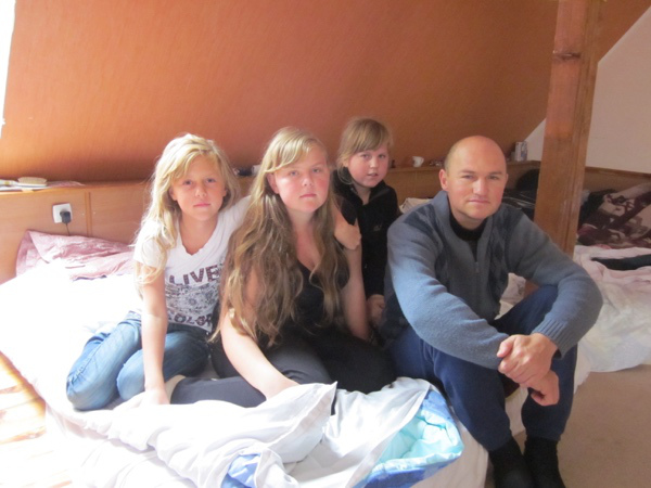 Vasiliy Klimov with three of his daughters; they fled twice.
