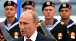 Russian President Vladimir Putin giving a speech celebrating the annexation of Crimea by Russia during his visit to the port of Sevastopol on May 9, 2014. (Image: YURI KADOBNOV/AFP/Getty Images)