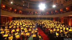 Polish filmmakers with Sentsov signs at awards ceremony