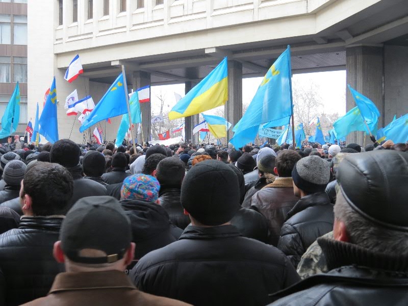 Crimean Tatar rally outside the Crimean Parliament in Simferopol which is being seized by unmarked armed men