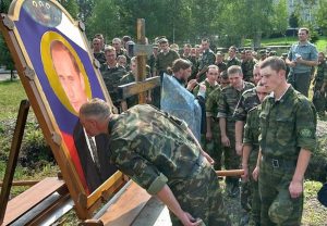 Russian soldiers line up near the border of Ukraine to kiss an “icon” of Putin. Summer 2014 (Image: Social media)