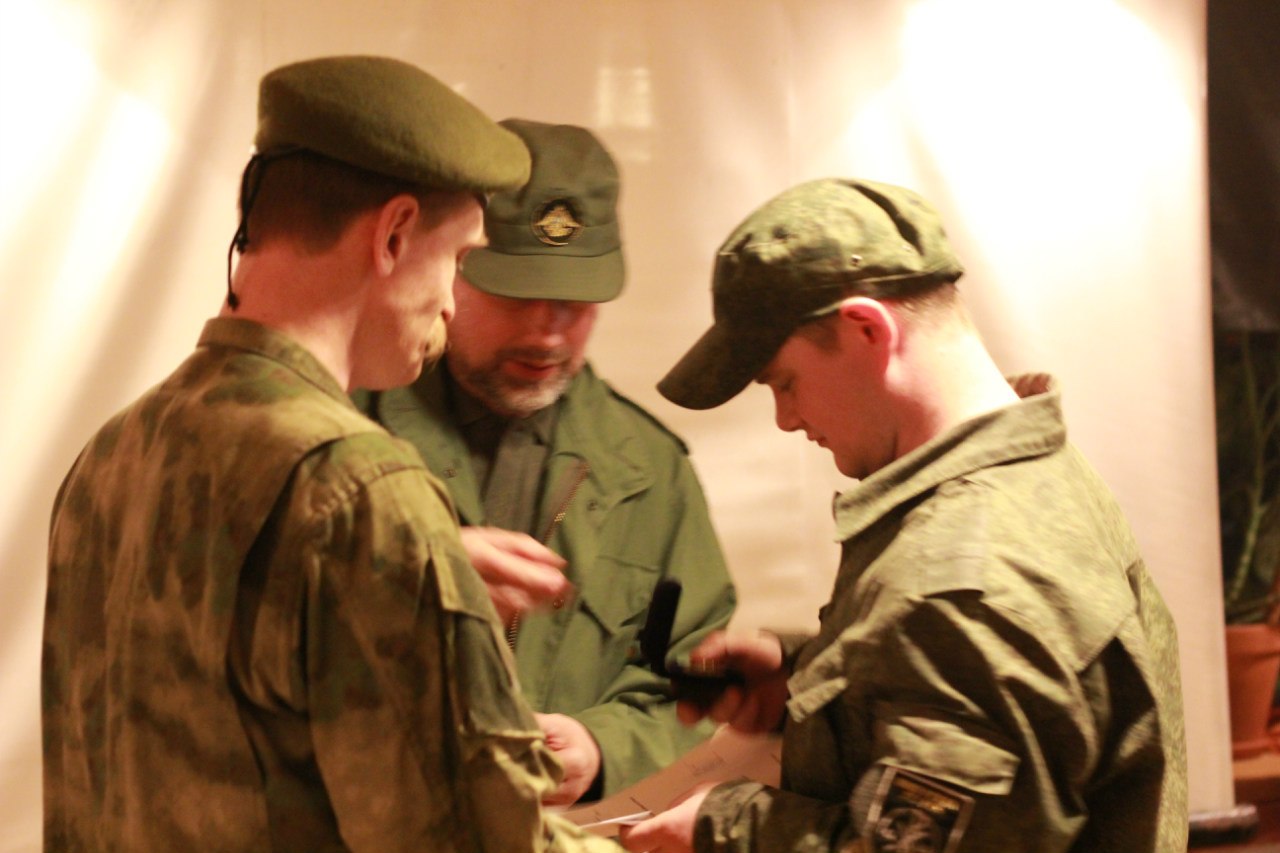 Stanislav Vorobyov (centre) decorates the fighters of the "Imperial Legion" who returned from Eastern Ukraine, St. Petersburg, Russia, 25 April 2015