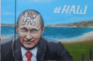 Russian propaganda posters in Crimea are getting defaced with graffiti representing how the Crimeans view Putin and his occupation of their land. October 2015 (Image: Social media)