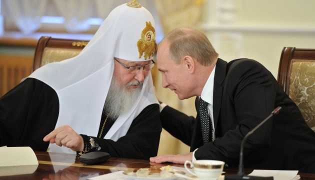 Putin with Kirill, the head of the Moscow Patriarchate of the Russian Orthodox Church (Image: Ukrinform.ru)