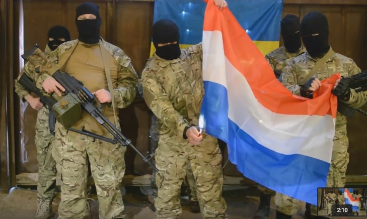 Fake Azov battalion members burning the Dutch flag. Screenshot of a YouTube video