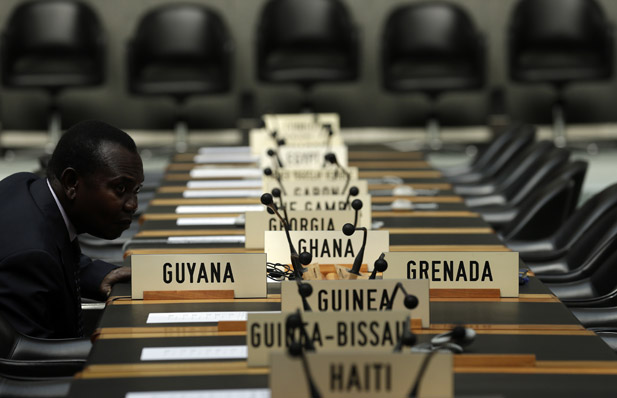 A delegate waits for the opening of a session of the Trade Negotiation Committee at the WTO in Geneva, July 22, 2013. (Denis Balibouse/Courtesy Reuters)