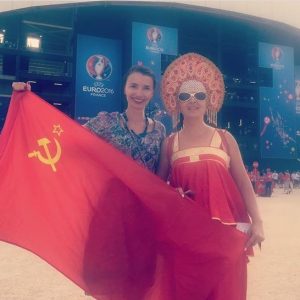 Russian female football/soccer fans posing with a national flag of the collapsed Soviet Union at the 2016 Euro Cup in France (Image: social media)