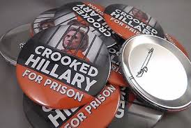 "Crooked Hillary For Prison" campaign buttons echoing Donald Trump repeated rallying cry to jail his political opponent Hillary Clinton