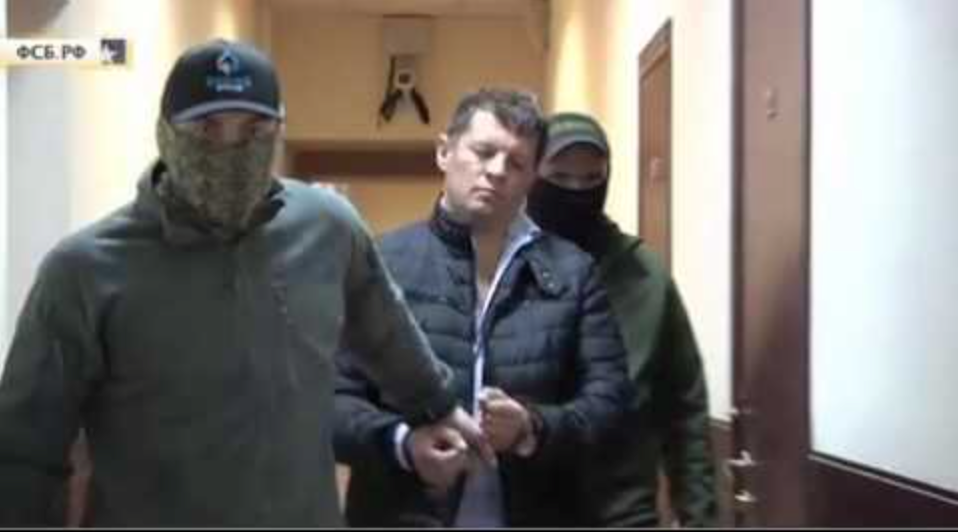 Handcuffed Sushchenko being led down the halls of a Russian remand prison. Image: snapshot from FSB video