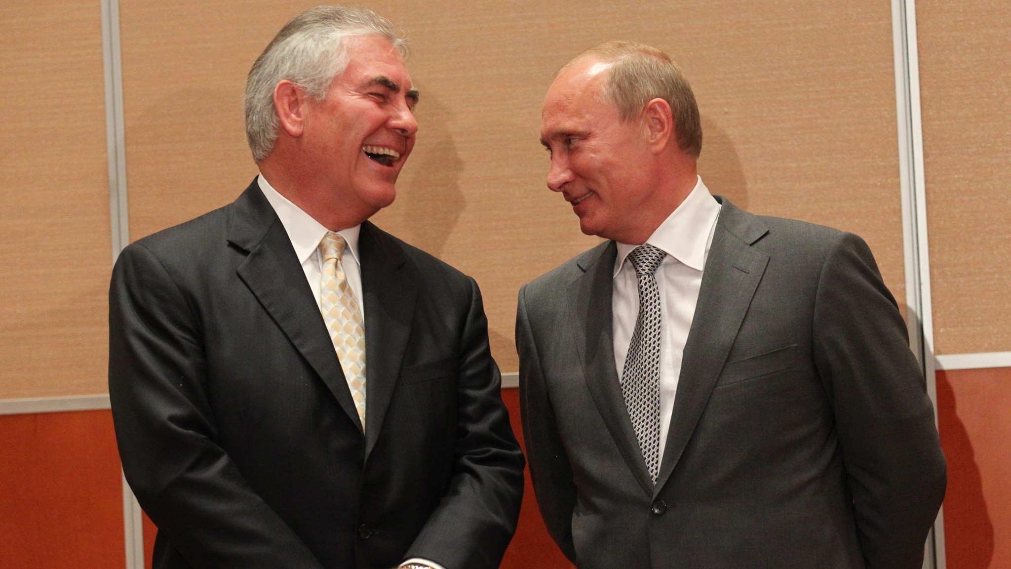 Sharing a laugh: Vladimir Putin with ExxonMobil CEO Rex Tillerson, Donald Trump’s pick for US secretary of state, the nation’s highest diplomatic post. (Image: Getty Images/Sasha Mordovets)