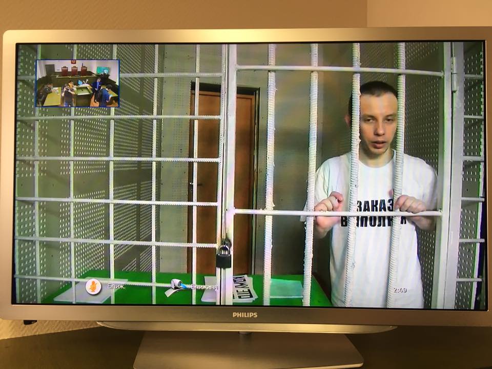 Ruslan Zeytullaev wears a t-shirt with the inscription "Order is fulfilled" on the day of his trial