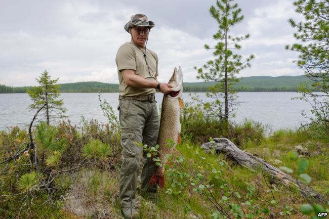 Putin with his trophy pike 