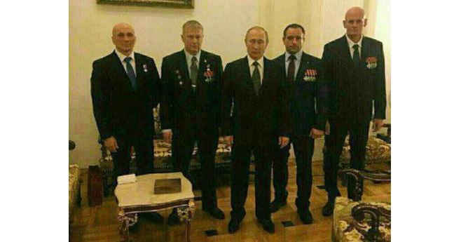 Russian president Vladimir Putin pictured with Dmitry Utkin ("Wagner") on the far right and other commanders of the Wagner private military company that fights on orders of the Russian military in Ukraine and Syria, but is not a part of it formally. This image is believed to date from December 2016.