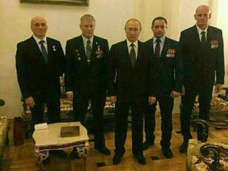 Russian president Vladimir Putin pictured with Dmitry Utkin ("Wagner") on the far right and other commanders of the Wagner private military company that fights on orders of the Russian military in Ukraine and Syria, but is not a part of it formally. This image is believed to date from December 2016.