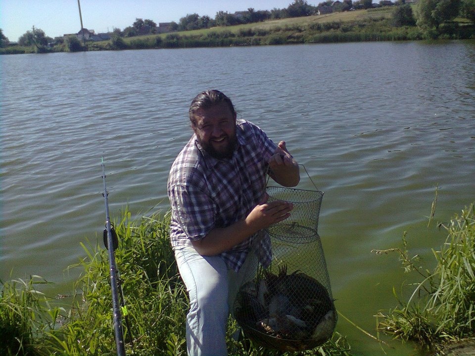 Picture from a peaceful life, 2012. Father Kostyantyn with a 16 kilo catch of carps