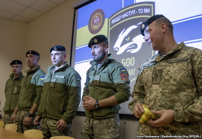 Vadym Sukharevsky and his mates at a meeting with students of the Mariupol National University