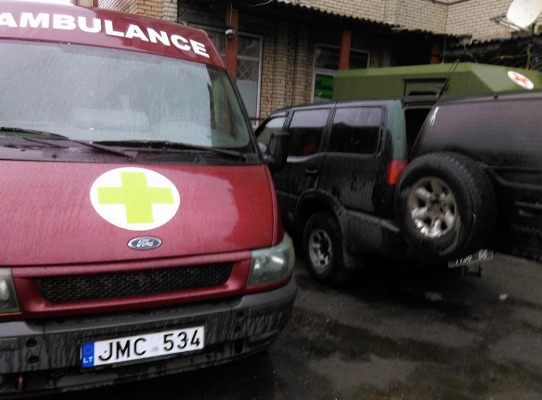 A Ford minibus, from Lithuania (note the license plates) functioning as ambulance at the 30th brigade. Note the Bohdan, hiding (maybe a little ashamed) behind the cars.