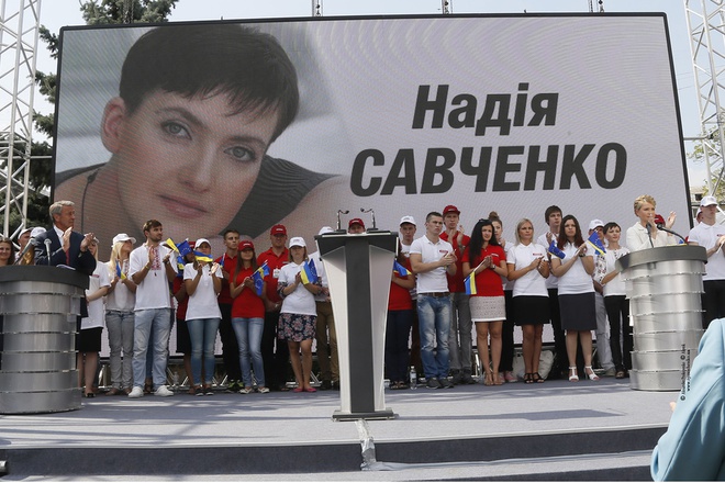 Nadiya Savchenko became part of Batkivshchyna's electoral campaign. Here, party leader Yuliya Tymoshenko is seen speaking in front of a billboard showing Nadiy Savchenko 