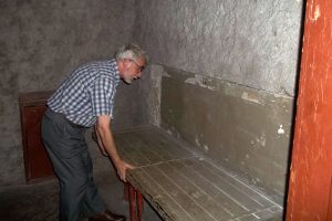 Deputy Director of Prison on Lontskoho Ihor Ozhyyivsky shows prison bunk beds