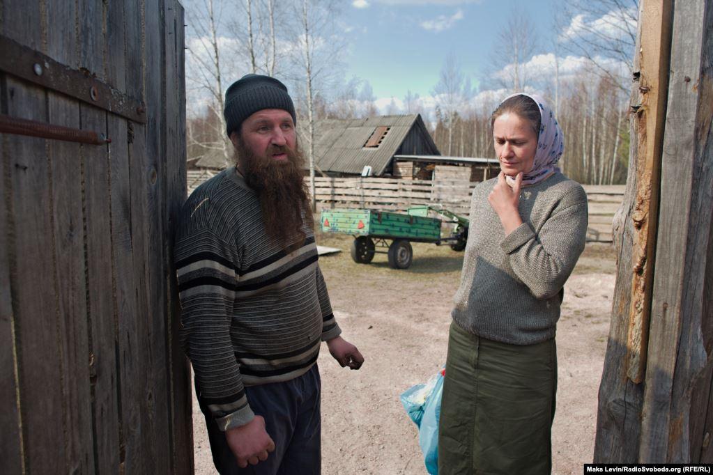 Locals of the village of Lichmani, father Alexander and his wife Natalia. They saved their home from a fire. Part of the hives burned down, sheep lost