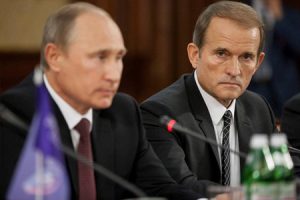 Putin and Medvedchuk, in happier times, at a press conference for Medvedchuk's political organization 