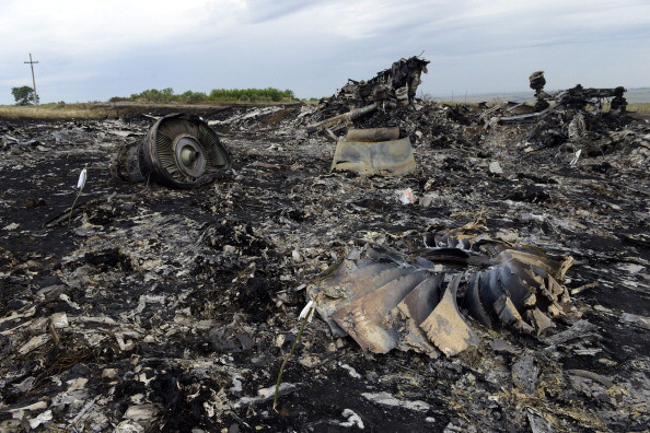 Debris at the site of the crash of a Malaysia Airlines flight MH17 with 298 people aboard downed by Russian BUK surface-to-air missile in Russia-occupied east Ukraine, on July 19, 2014. (Image: Alexander KHUDOTEPLY/AFP/Getty Images)