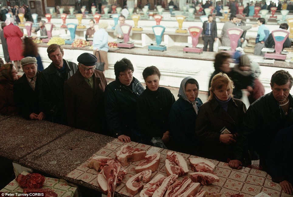 A long queue forms in Novokuznetsk for bacon and other meat from the butcher at a state-run market