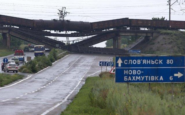 Russian-backed terrorists are deliberately destroying the infrastructure of the Donbas. Destroyed railway bridge over the road Sloviansk-Donetsk-Mariupol