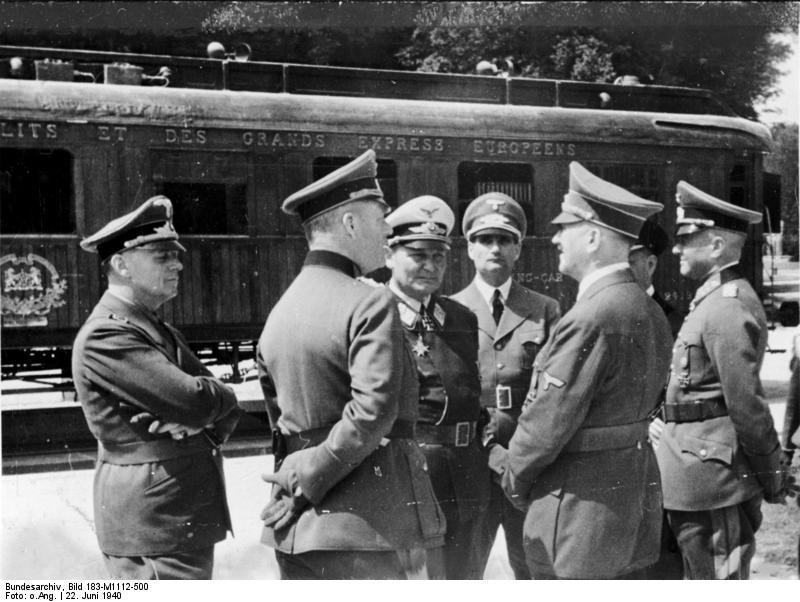 Left to right: Joachim von Ribbentrop, Walther von Brauchitsch, Hermann Göring, Rudolf Hess, Adolf Hitler, and Walther von Brauchitsch in front of the Armistice carriage, June 22, 1940
