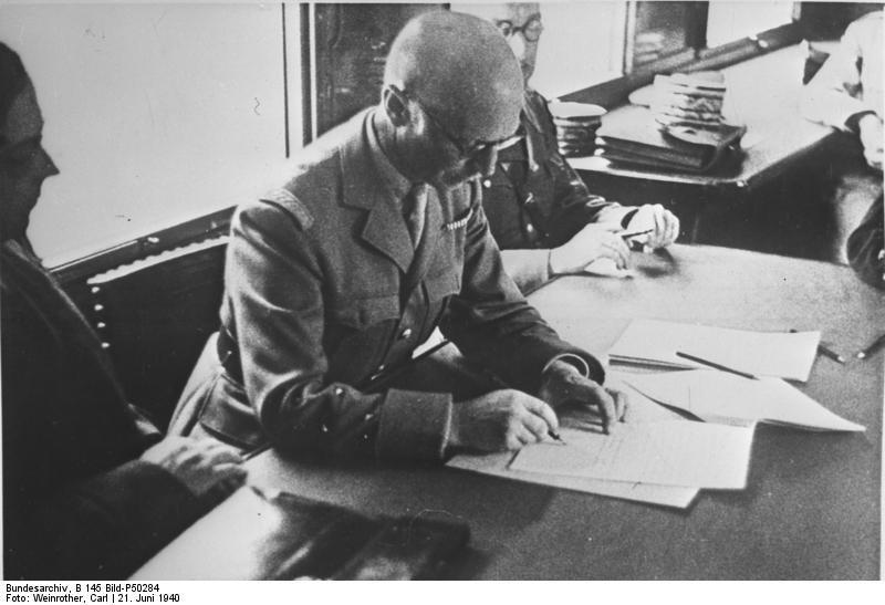 General Charles Huntziger signs the armistice on behalf of France.