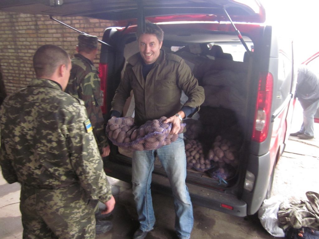 Volunteer Sergey unloads some potatoes for Ukrainian troops on Saturday.