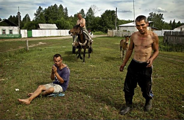 Russia's long-term problem, alcoholism, has become even more widespread during almost two decades of Putin's reign. Drunken villagers in southern Siberia, Russia (Image: rus-img2.com)