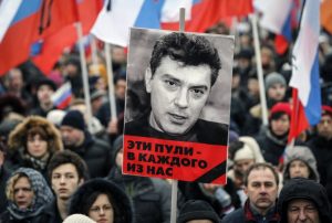 Boris Nemtsov Memorial March. The sign says in Russian: "These bullets hit all of us"