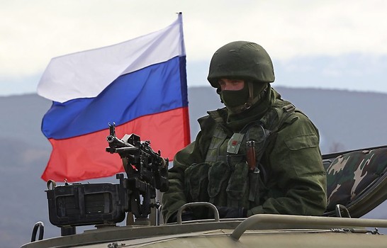 A soldier of the Russian occupation force atop an IFV in Crimea. (Image: epa.eu)