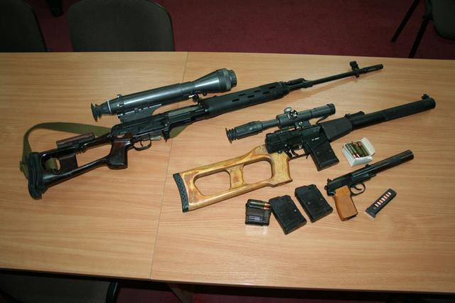 Russian "SVD" sniper rifle, "Vintorez" Russian special forces' sniper rifle, and "6P9" special forces' silenced pistol seized from the members of the arrested terrorist and spy group operating in Kharkiv, which was recruited and controlled by Russian military intelligence. (Image: SBU)