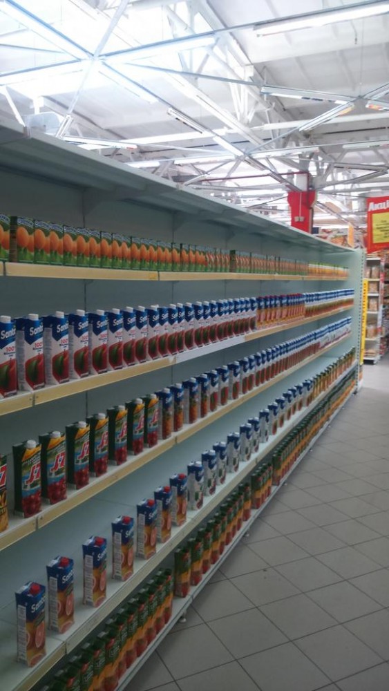 As tourism to Crimea has undergone a major contraction, a major supermarket chain "Furshet" in Yalta has reduced its inventory to a minimum and fills the empty shelves with bottles of water and drinks one-bottle deep. June 2015. (Image: Twitter)