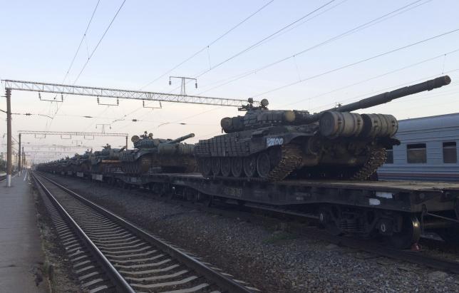 Unmarked Russian tanks are seen on a freight train shortly after its arrival at a railway station in the Russian southern town of Matveev Kurgan, near the Russian-Ukrainian border in Rostov region, Russia, May 26, 2015. Picture taken with a mobile phone. REUTERS/Maria Tsvetkova