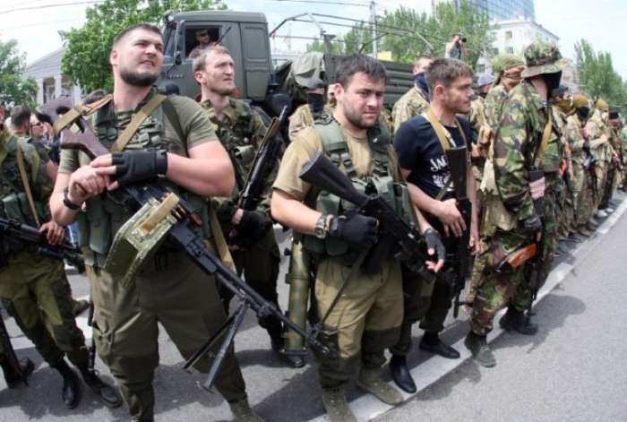 The Russian Federation have been using ethnically non-Russian troops for its aggression in Ukraine. Russian Federation servicemen from Chechnia arriving to fight in the Donbas in 2014 (Image: AFP)