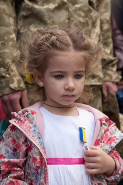 The photo of a little girl receiving the metal of her father, Andriy Matviyenko, killed in the Donbas, that was massively blocked by Facebook "for nakedness."