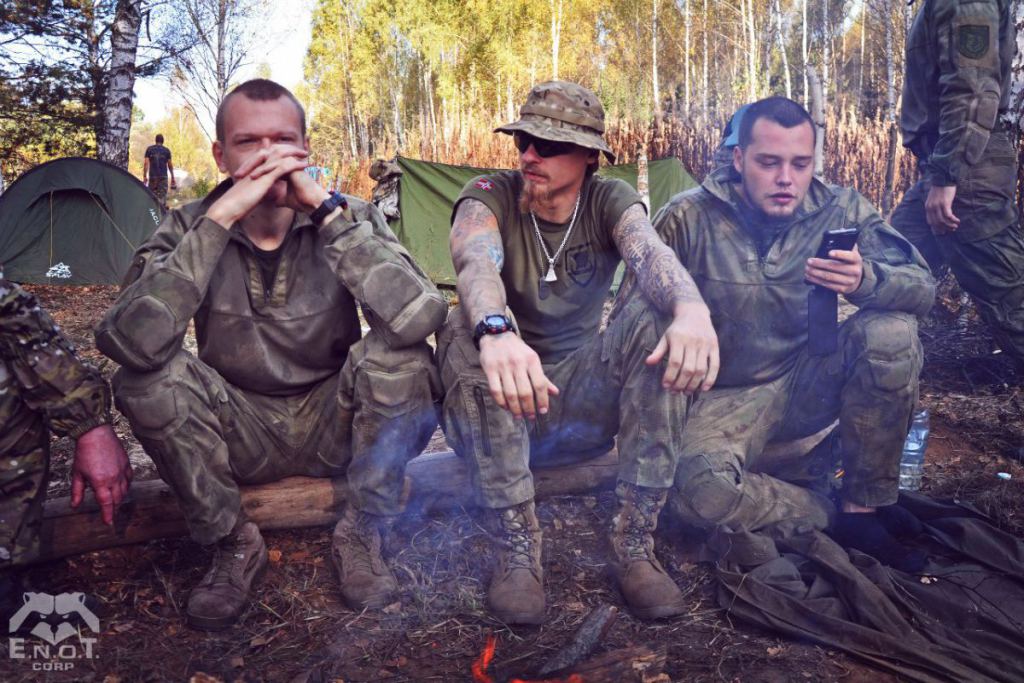 A prominent Russian neo-Nazi Alexey Milchakov (right) with other instructors at the mercenary training camp for Russia's war in Ukraine. Moscow oblast, Russia, September 2015 (Image: ENOT Corp.)