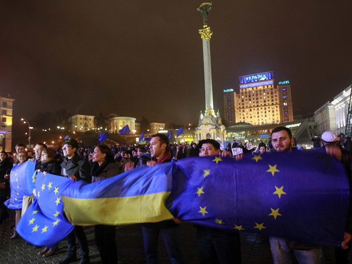Euromaidan protesters hold EU and Ukrainian flags in the center of Kyiv in winter of 2013-2014