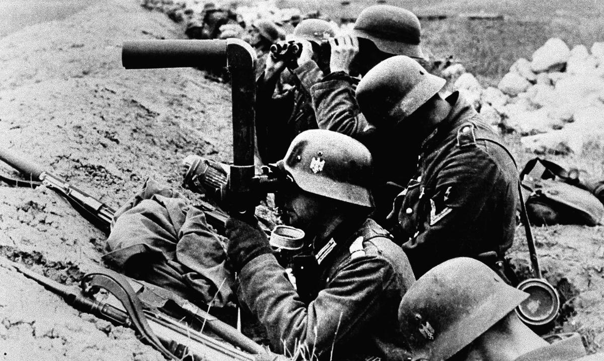 German infantrymen watch enemy movements shortly before an advance inside Soviet territory, on July 10, 1941. (Image: AP)