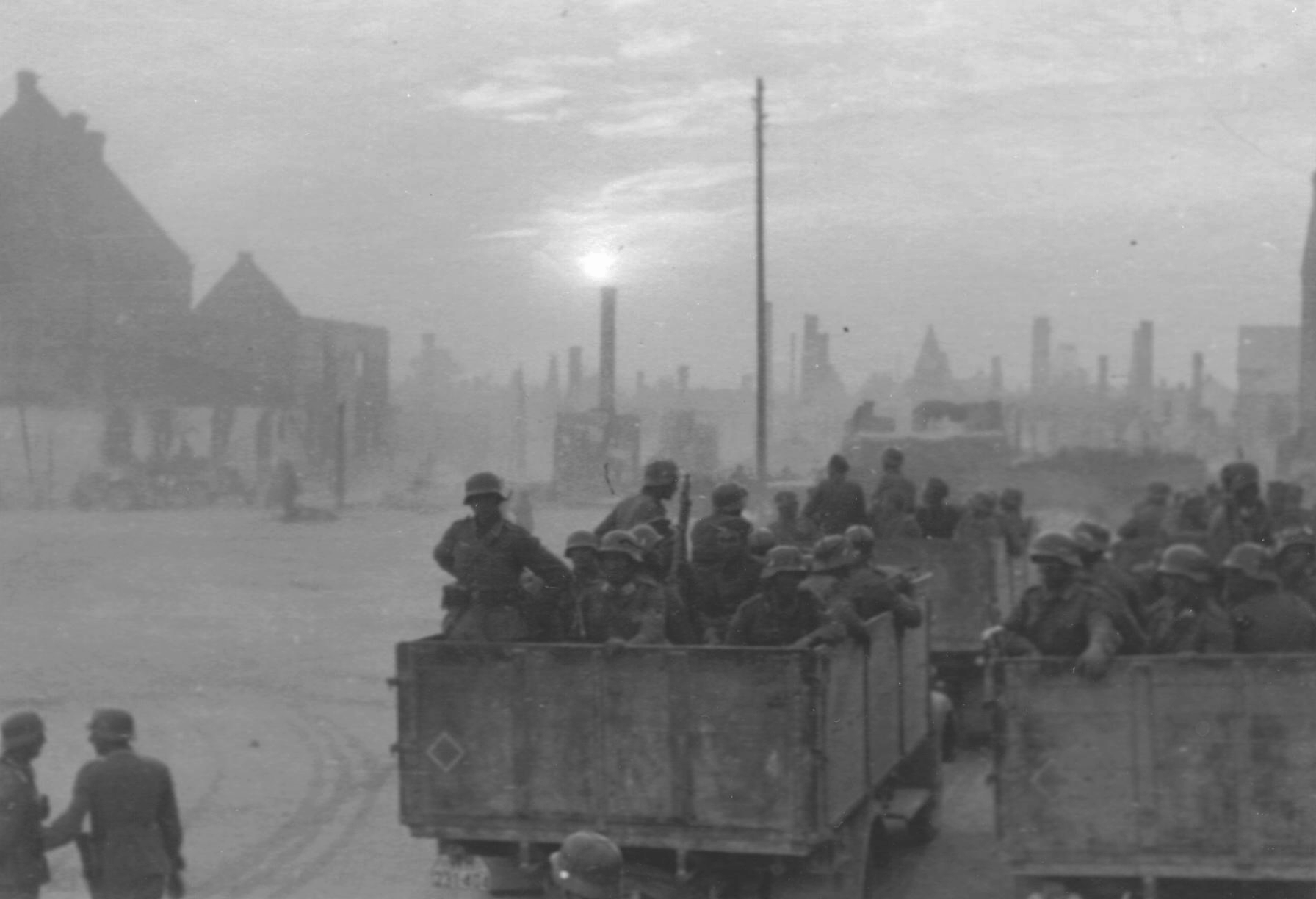 German soldiers boarding trucks to leave the Polish town they destroyed, September 1939