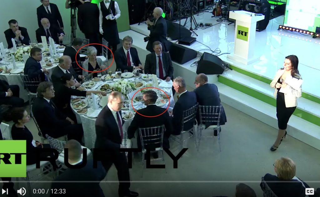 Former national security advisor, former Director of US Defense Intelligence Agency, retired Lieutenant General Mike Flynn at a conference and gala dinner celebrating the 10th anniversary of Russia’s propaganda arm, media channel “RT” (formerly “Russia Today”) seated at the head table at the gala, with Vladimir Putin, his then-chief of staff, Sergei Ivanov and press spokesman Dmitry Peskov, among other Russian officials. Also seated at the same table is 2016 Green Party candidate for president Dr. Jill Stein. December 10, 2015 in Moscow. (Image: video capture)