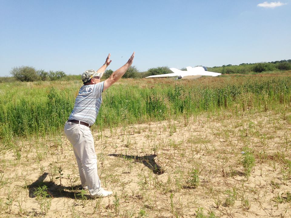 Volunteer instructor Viktor demonstrates launching the UAV at training event