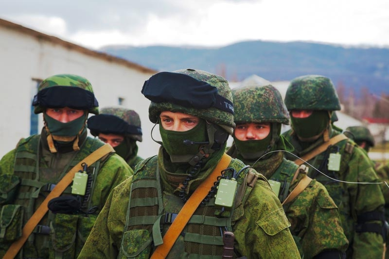 Masked Russian servicemen blockading a Ukrainian military base in Crimea. March 2014