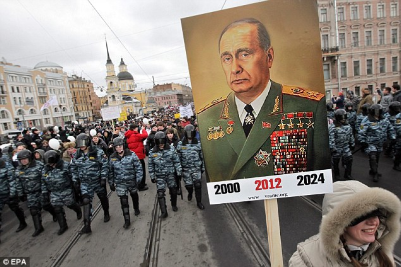 Surrounded by riot police, demonstrators in St. Petersburg carry a poster depicting Prime Minister Vladimir Putin as the elderly Soviet Communists party leader Leonid Brezhnev in February 2012, with less than a week remaining before he was elected as Russian President for the third time (Image: EPA)