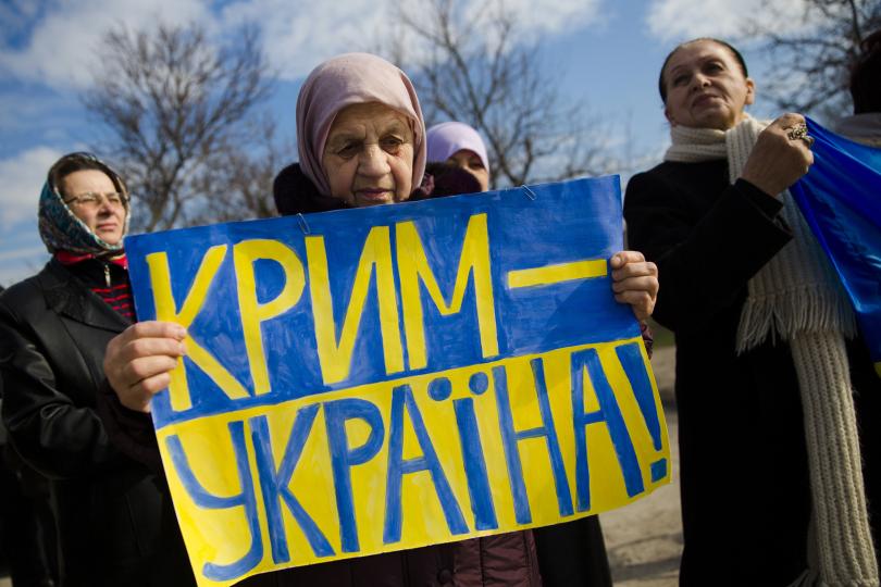 Crimean Tatars attend a pro-Ukraine rally in Simferopol during the Russian special operation to annex Crimea. March 14, 2014.