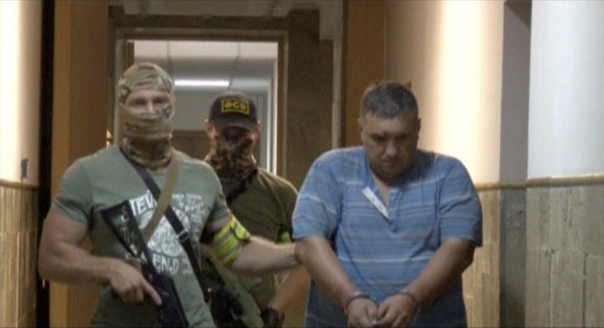 Yevhen Panov says the Russian FSB tortured him into "confessing" he is a Ukrainian saboteur sent to Crimea. Photo: screen capture from video of Panov's detention